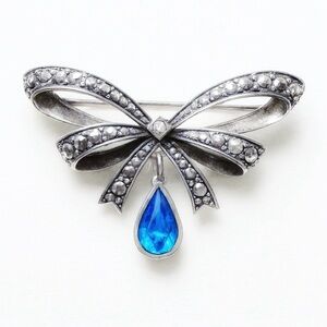 Vintage Avon September Birthstone Bow Pin Brooch Silver Tone with Blue Stone